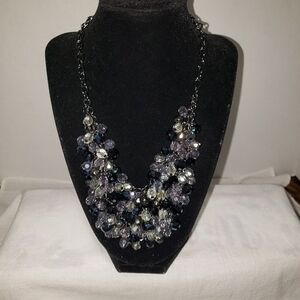 Vintage black necklace with a bib of iridescent beads